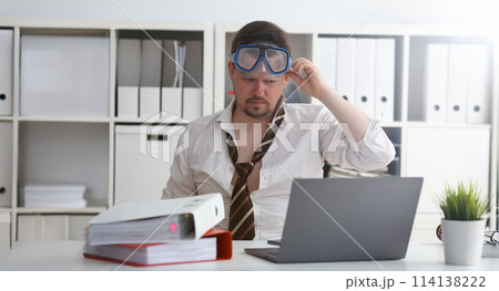 Man wearing suit and tie in goggles with snorkel Man wearing suit and tie in goggles with snorkel 114138222