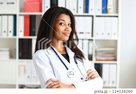 Beautiful black smiling female doctor portrait 114138260