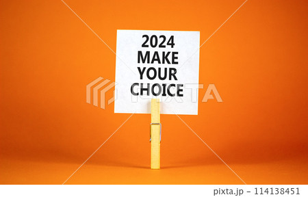 2024 Make your choice symbol. Concept words 2024 Make your choice on beautiful white paper on clothespin. Beautiful orange background. Business 2024 Make your choice concept. Copy space 114138451