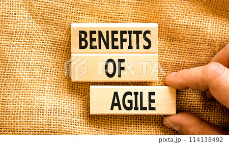 Benefits of agile symbol. Concept words Benefits of agile on beautiful wooden blocks. Beautiful canvas table canvas background. Businessman hand. Business benefits of agile concept. Copy space. Benefits of agile symbol. Concept words Benefits of agile on beautiful wooden blocks. Beautiful canvas table canvas background. Businessman hand. Business benefits of agile concept. Copy space. 114138492