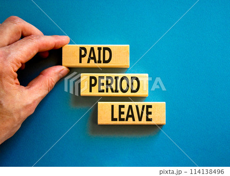 Paid period leave symbol. Concept words Paid period leave on wooden blocks. Beautiful blue table blue background. Doctor hand. Business medical paid period leave concept. Copy space. 114138496
