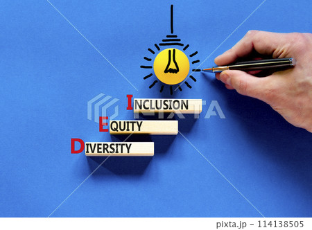 DEI diversity equity and inclusion symbol. Concept words DEI diversity equity inclusion on blocks. Beautiful blue background. Business DEI diversity equity and inclusion concept. Copy space. DEI diversity equity and inclusion symbol. Concept words DEI diversity equity inclusion on blocks. Beautiful blue background. Business DEI diversity equity and inclusion concept. Copy space. 114138505