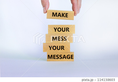 Business concept growth success process. Wood blocks on white background, copy space. Businessman hand. Words 'make your mess your message'. Conceptual image of motivation. 114138603