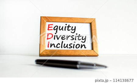 EDI equity diversity inclusion symbol. Concept words EDI equity diversity inclusion on beautiful wooden frame. Beautiful white background. Business EDI equity diversity inclusion concept. Copy space. EDI equity diversity inclusion symbol. Concept words EDI equity diversity inclusion on beautiful wooden frame. Beautiful white background. Business EDI equity diversity inclusion concept. Copy space. 114138677