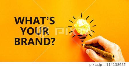 Branding what is your brand symbol. Concept words What is your brand on beautiful orange paper. Beautiful orange background. Businessman hand. Business branding what is your brand concept. Copy space. Branding what is your brand symbol. Concept words What is your brand on beautiful orange paper. Beautiful orange background. Businessman hand. Business branding what is your brand concept. Copy space. 114138685