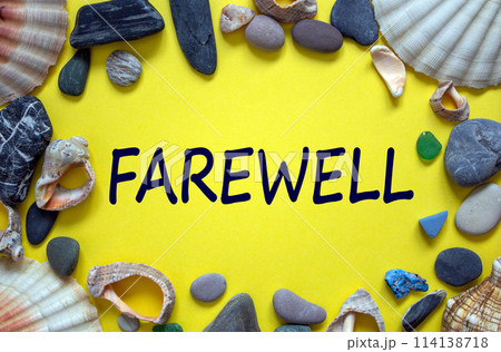 Text 'farewell' on a beautiful yellow background. Sea stones and seashells. Concept. 114138718
