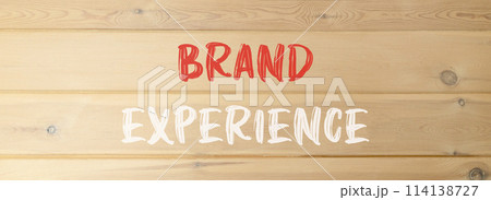 Brand experience symbol. Concept words Brand experience on beautiful wooden wall. Beautiful wooden wall background. Business branding and brand experience concept. Copy space. Brand experience symbol. Concept words Brand experience on beautiful wooden wall. Beautiful wooden wall background. Business branding and brand experience concept. Copy space. 114138727
