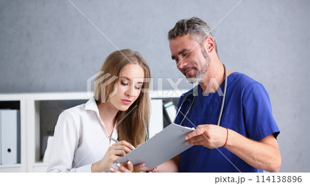 Handsome mature doctor offer pad sign with Handsome mature doctor offer pad sign with 114138896