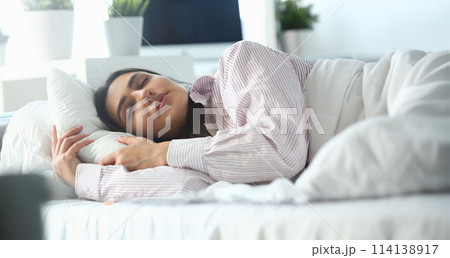 Beautiful indian woman peacefully lying 114138917