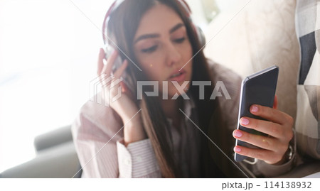 Young beautiful woman look camera holds 114138932