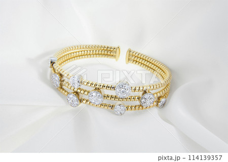 Gold Diamond Bracelet on Elegant White Satin 114139357