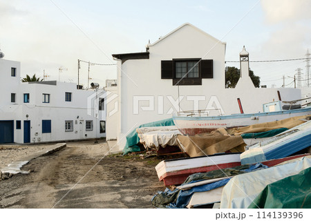 Arrecife White Architecture and Colorful Boats on Shore 114139396
