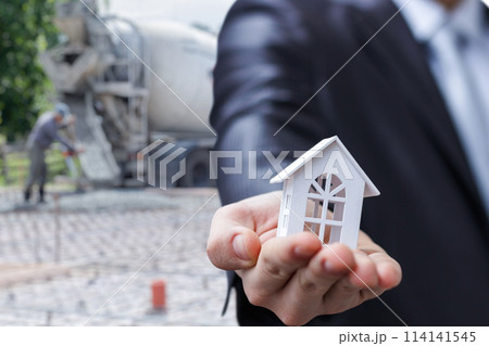 Concept of investment in real estate on pouring the foundation. Concept of investment in real estate on pouring the foundation. 114141545