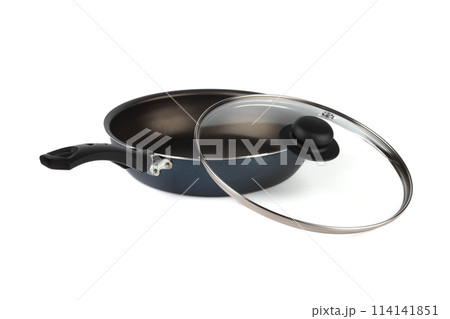 New skillet with black handle and glass lid on a white background. 114141851