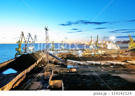 Maritime Bulk Terminal dry cargo handling at night. Maritime Bulk Terminal dry cargo handling at night. 114142124