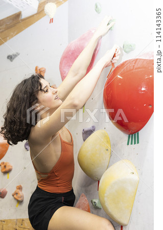 girl climbing up the wall girl climbing up the wall 114143365