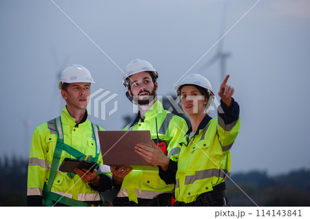 Engineer wearing safety uniform using tablet discussed plan about renewable energy Engineer wearing safety uniform using tablet discussed plan about renewable energy 114143841