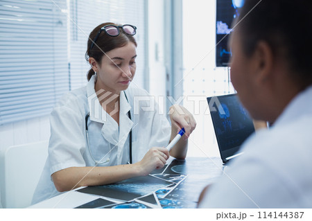 Female medical student study in class room. medical students studying human brain disease diagnosis 114144387