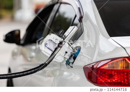 Close Up of pump nozzle Compressed Natural Gas (cng) in tank for car.  114144718