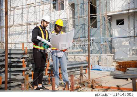 Construction civil engineer man and woman African American checking quality of work Construction civil engineer man and woman African American checking quality of work 114145003