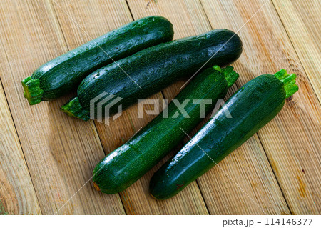 Organic zucchini on wooden cutting board. Healthy nutrition concept 114146377
