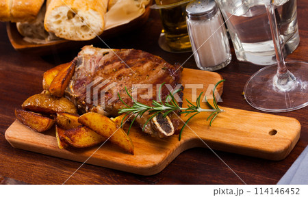 Appetizing beef steak with potatoes and rosemary Appetizing beef steak with potatoes and rosemary 114146452