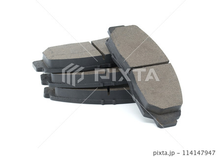 New auto brake pads isolated on white background New auto brake pads isolated on white background 114147947