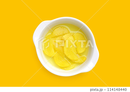 Sweet and tart slices of yellow pickled daikon, known as takuan in Japan and danmuji in Korea. 114148440