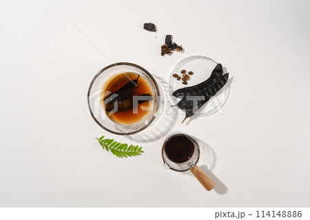 Fresh composition for cosmetic or shampoo made from black locust isolated on minimalist background. High angle shot photo with blank space for advertising 114148886