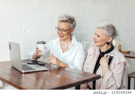 two businesswoman using laptop in morning. Business, financial People and lifestyles 114149194