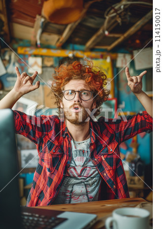 Man With Red Hair Working at Computer 114150017
