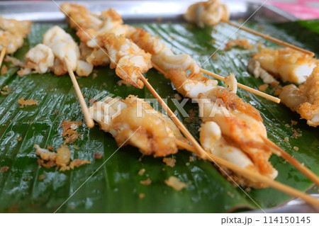 Squid eggs grilled on banana leaf. Seafood on street food in Thailand 114150145