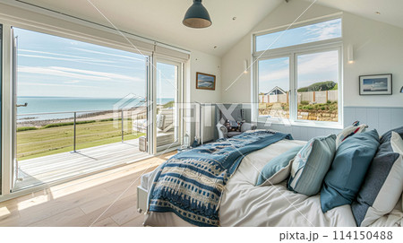 Beautiful interior of luxury bedroom with window sea view. Coastal cottage concept. High quality photo 114150488