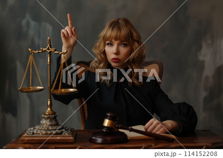 A young fair woman judge works in her office. 114152208