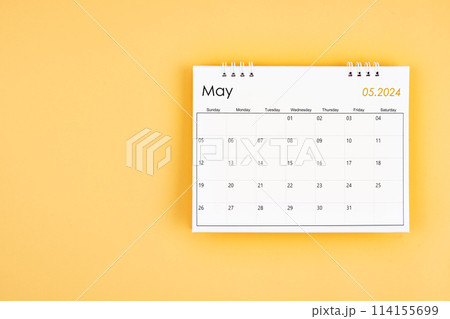 May 2024 desk calendar on yellow color background, position with copy space. May 2024 desk calendar on yellow color background, position with copy space. 114155699
