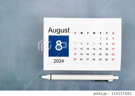 August Calendar 2024 page with pen on wooden background. 114155882