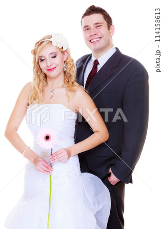 Happy groom and bride posing for marriage photo Happy groom and bride posing for marriage photo 114158613