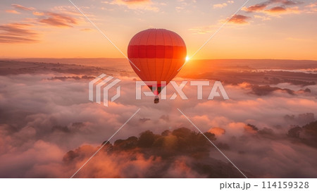 Serene hot air balloon floats above clouds under a golden sunrise 114159328