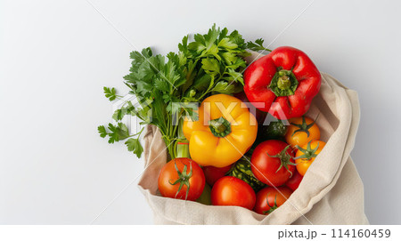 AI-generated item. Fresh vegetables in a reusable shopping bag on a white background. Top view. 114160459