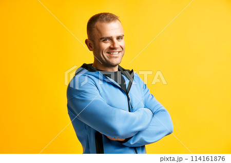 Confident sporty man with arms crossed Confident sporty man with arms crossed 114161876