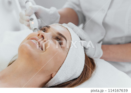 The beautician uses vacuum massage to provide the client with an effective and pleasant facial skin rejuvenator. This type of massage helps to increase blood circulation, restore muscle tone and The beautician uses vacuum massage to provide the client with an effective and pleasant facial skin rejuvenator. This type of massage helps to increase blood circulation, restore muscle tone and 114167639