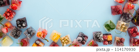 Frame of ice cubes with frozen berries 114170930