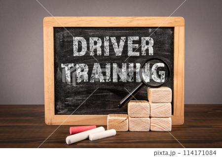 Driver Training. Chalkboard with text on wooden texture table 114171084