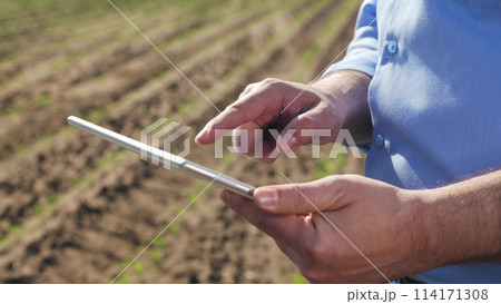 Businessman digital agricultural farmer with tablet. Hands palms use gadget tablet check current data on weather prices for agricultural products new technologies access to useful business information Businessman digital agricultural farmer with tablet. Hands palms use gadget tablet check current data on weather prices for agricultural products new technologies access to useful business information 114171308