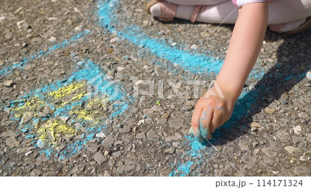 child hand drawing chalk asphalt, child kid childhood dream, little artist playground park girl daughter, outdoor drawing session, pavement chalk game, colorful pavement design, cheerful outdoor art 114171324
