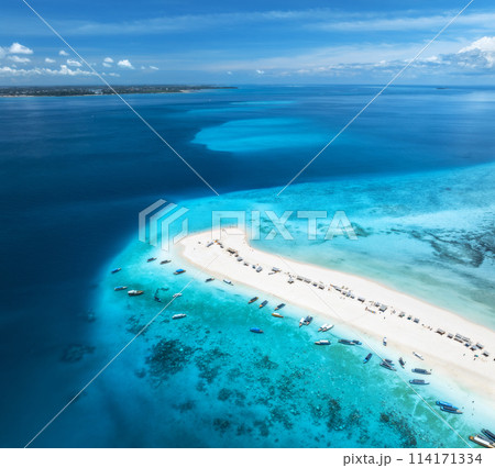 Aerial view of island, sandbank, sandy beach, boats, blue sea Aerial view of island, sandbank, sandy beach, boats, blue sea 114171334