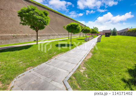 Amazing cityscape and aged medieval defense fortification walls with green lawn in medieval fortress of Alba Iulia (Carolina). Amazing cityscape and aged medieval defense fortification walls with green lawn in medieval fortress of Alba Iulia (Carolina). 114171402