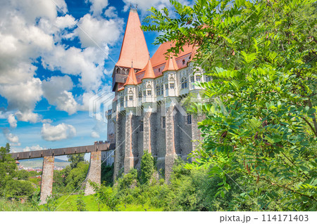 Captivating morning view of Hunyad Castle / Corvin's Castle with wooden bridge. Captivating morning view of Hunyad Castle / Corvin's Castle with wooden bridge. 114171403