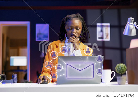 African american woman working on laptop, sending emails to business partners, online connectivity concept. Remote worker using XR augmented reality tech to interact with notebook screen African american woman working on laptop, sending emails to business partners, online connectivity concept. Remote worker using XR augmented reality tech to interact with notebook screen 114171764
