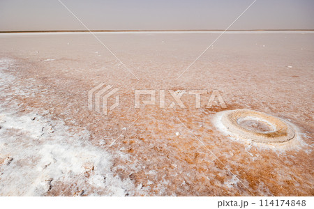 Tunisian Sahara Desert - salt lake of Sebkhet El Melah (Lac sale de Zarzis) in the lowlands 114174848